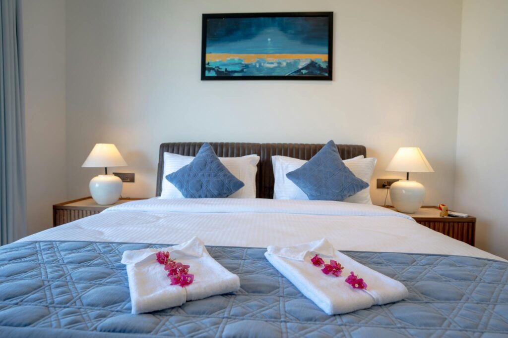 Elegant villa bedroom in Goa with stylish decor and cozy ambiance.